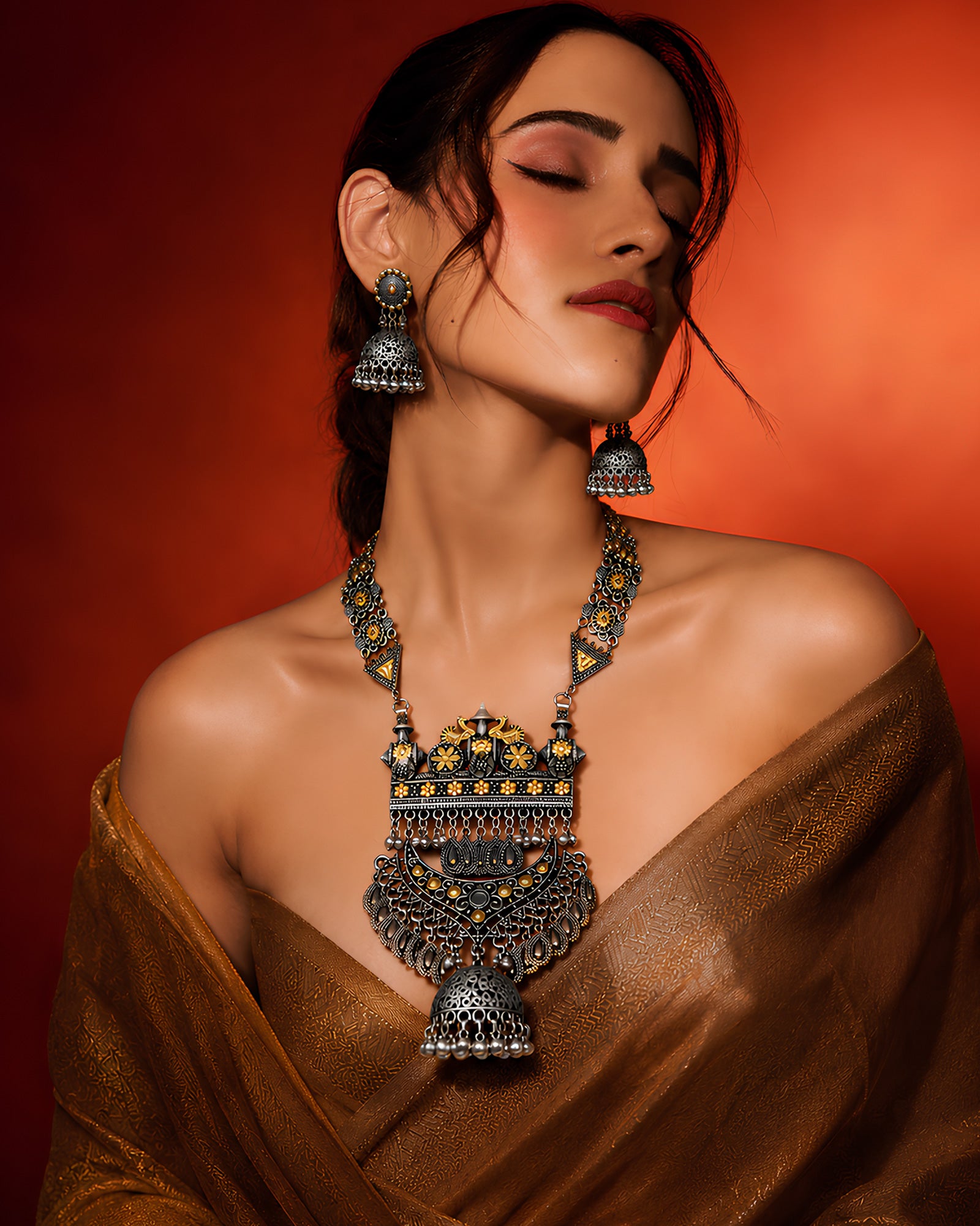 Dual-Tone Architectural Shield & Tiered Open-Work Jhumka Haar Set