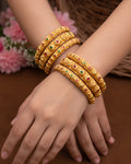 Traditional Floral Sunburst Gold-Tone Bangles